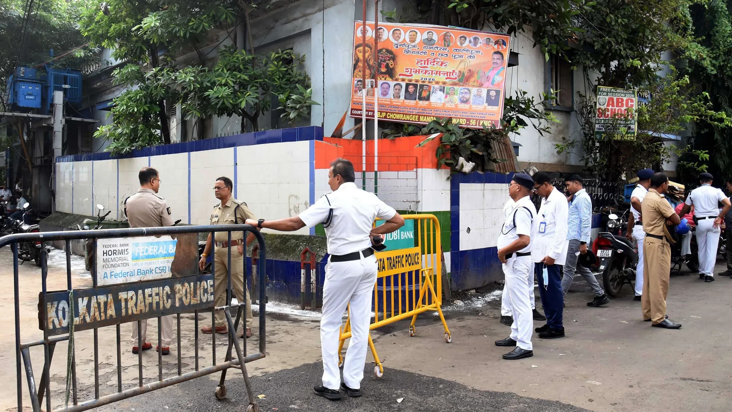 Security personnel present near the morgue following the Chorbagan Durga Puja pandal stampede (Oct 17), in Kolkata on Sunday.